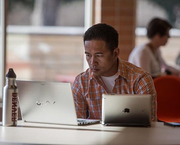 Student studying on laptop and tablet